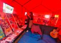Lukisan dan buku antologi puisi dan cerpen ikut dipamerkan di stan pameran di lokasi Merangin Expo. (DETAIL/ist)