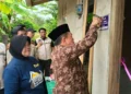 Disaksikan Bupati Syukur, Gubernur Al Haris Serahkan Bantuan Bedah Rumah di Merangin