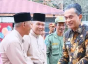 Wabup Junaidi Mahir Ajak Masyarakat Terus Jaga Semangat Gotong Royong Saat Hadiri Peringatan HUT Desa Tangkit ke-70